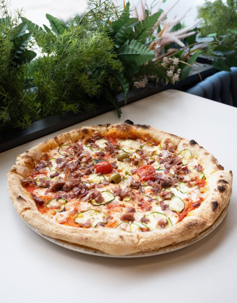 Neapolitan Amatriciana pizza at Serenada Bistro Dubrovnik with tomato sauce, pancetta, cheese and zucchini