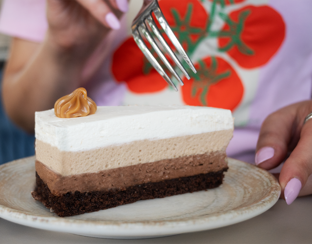 Three chocolate cake at Bistro Serenada in Dubrovnik featuring rich layers of dark, milk, and white chocolate mousse, a popular dessert for tourists searching for the best cakes and sweets in Dubrovnik Croatia.