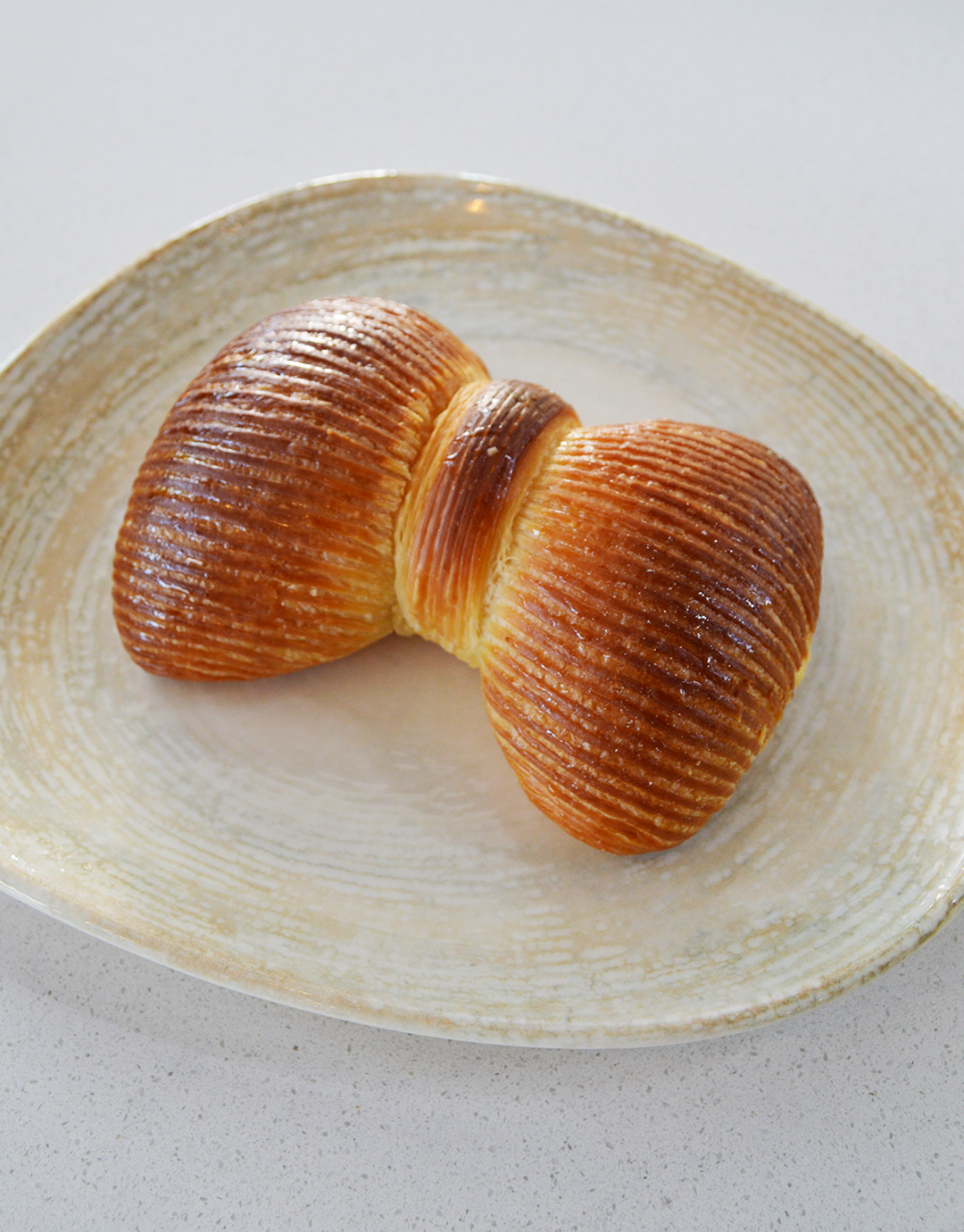 Freshly baked braided pastry with golden crust and delicate layers at Serenada Bistro Dubrovnik