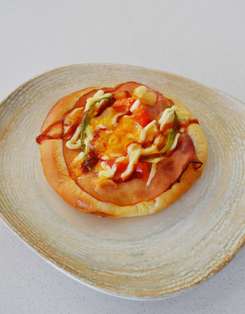 Freshly baked mini pizza with melted cheese and a golden crust at Serenada Bistro Dubrovnik